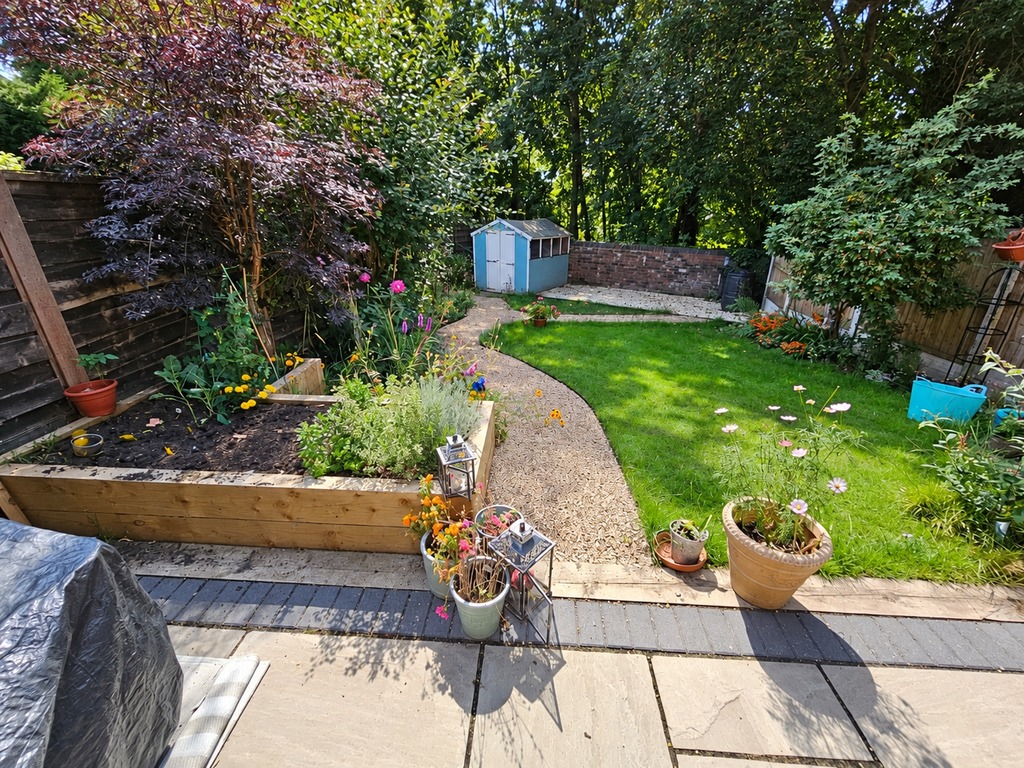 The same Prestwich garden in September, fully planted and green